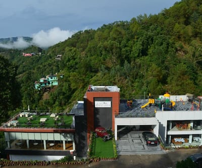 https://imgcld.yatra.com/ytimages/image/upload/t_hotel_yatra_city_desktop/v1446116560/Domestic Hotels/Hotels_Shimla/Resort Eutopia/Front_view.jpg